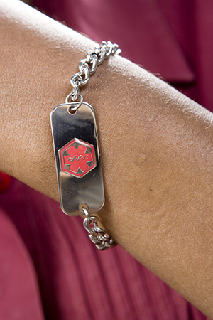 Close up of medical alert bracelet.